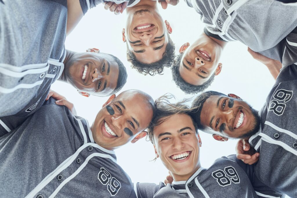 Sport, baseball and team huddle portrait for game mental preparation together with cheerful smile.